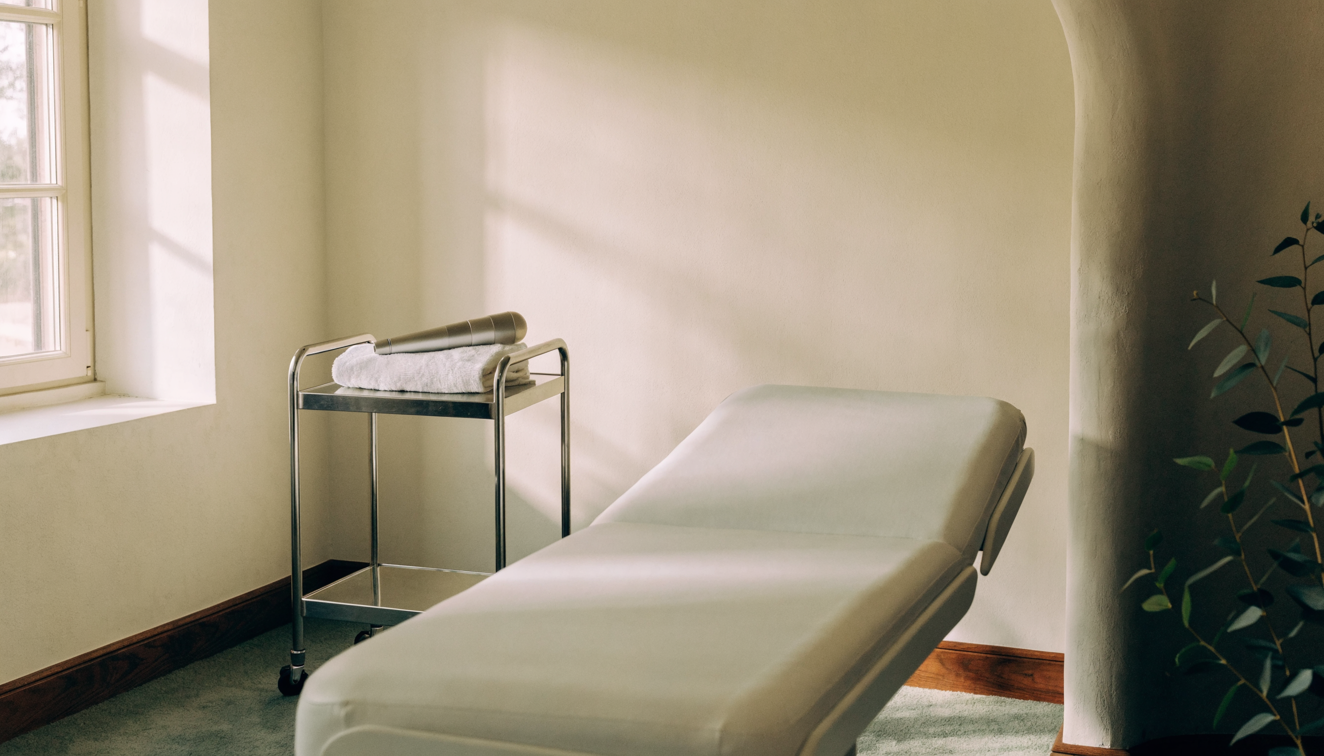 A wide, empty treatment room in soft daylight