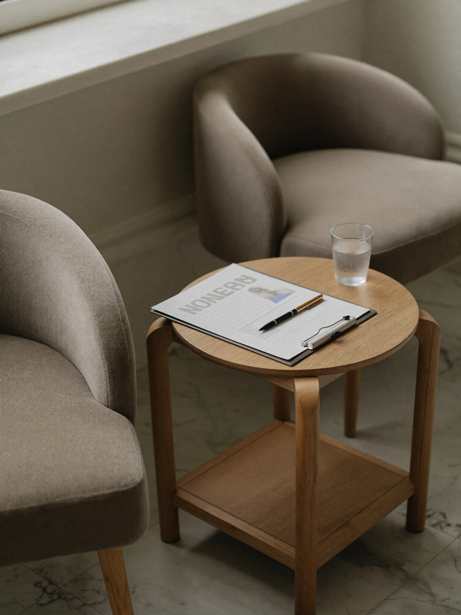 A quiet, private consultation setting in warm neutral tones