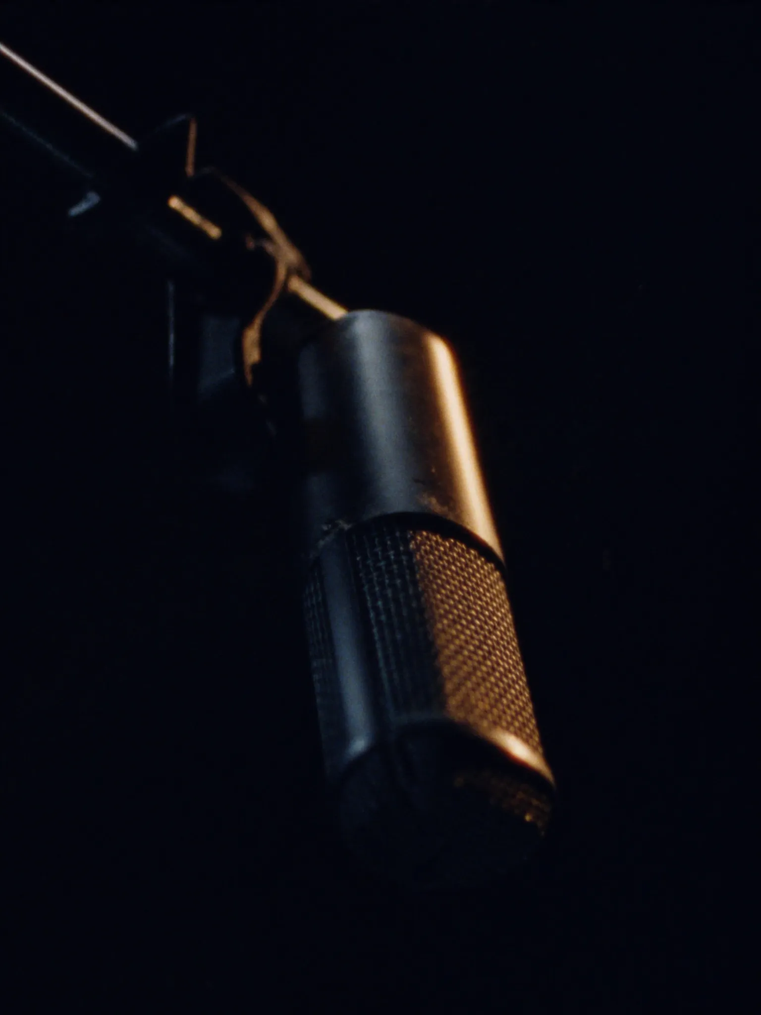 Broadcast microphone in dramatic light