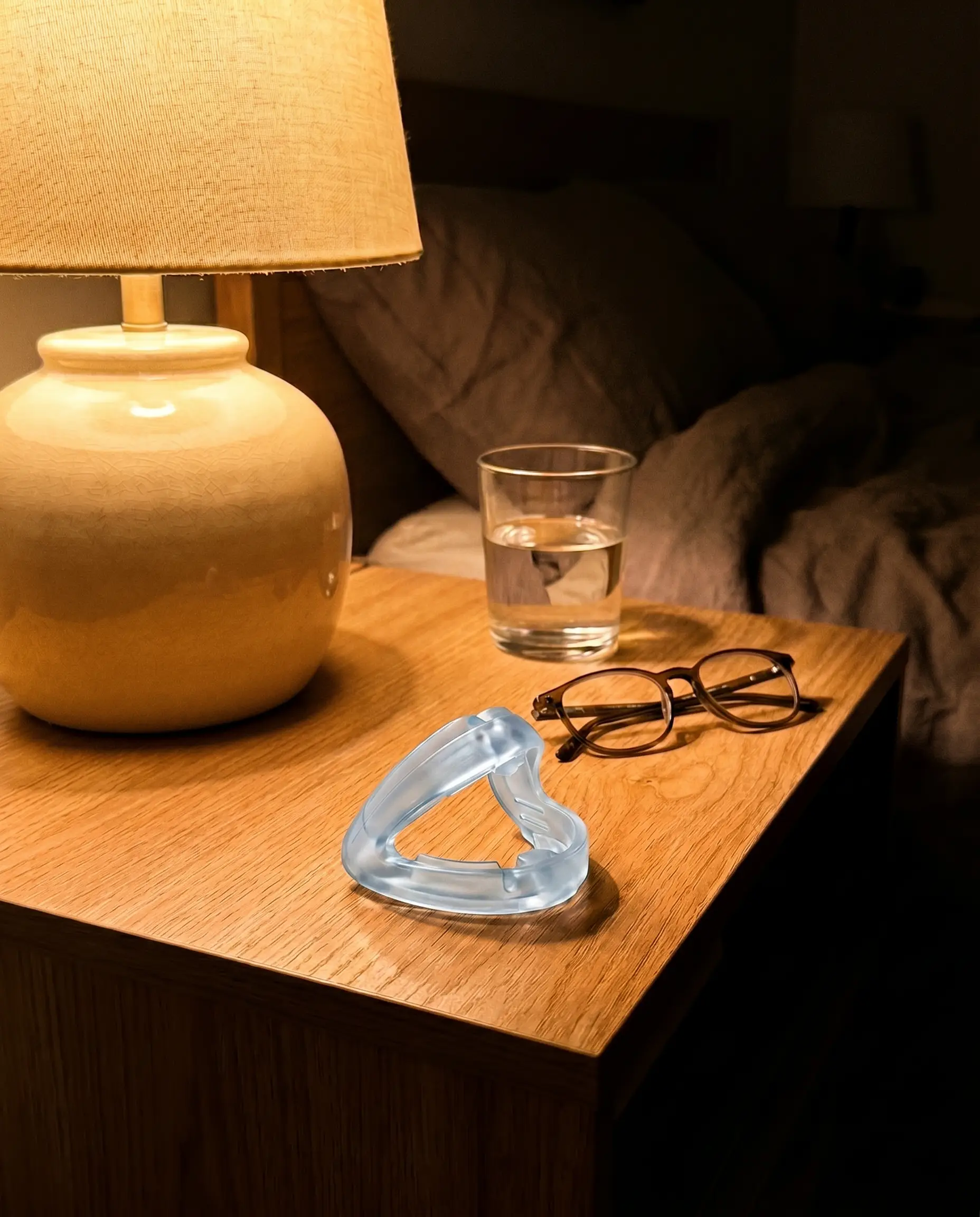 Customer review photo of the QuietNight mouthpiece on a nightstand
