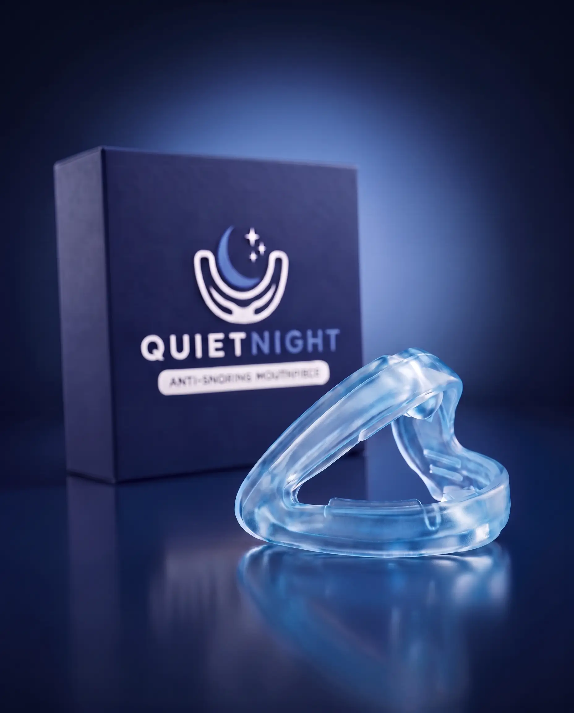 The clear QuietNight anti-snoring mouthpiece beside its navy box