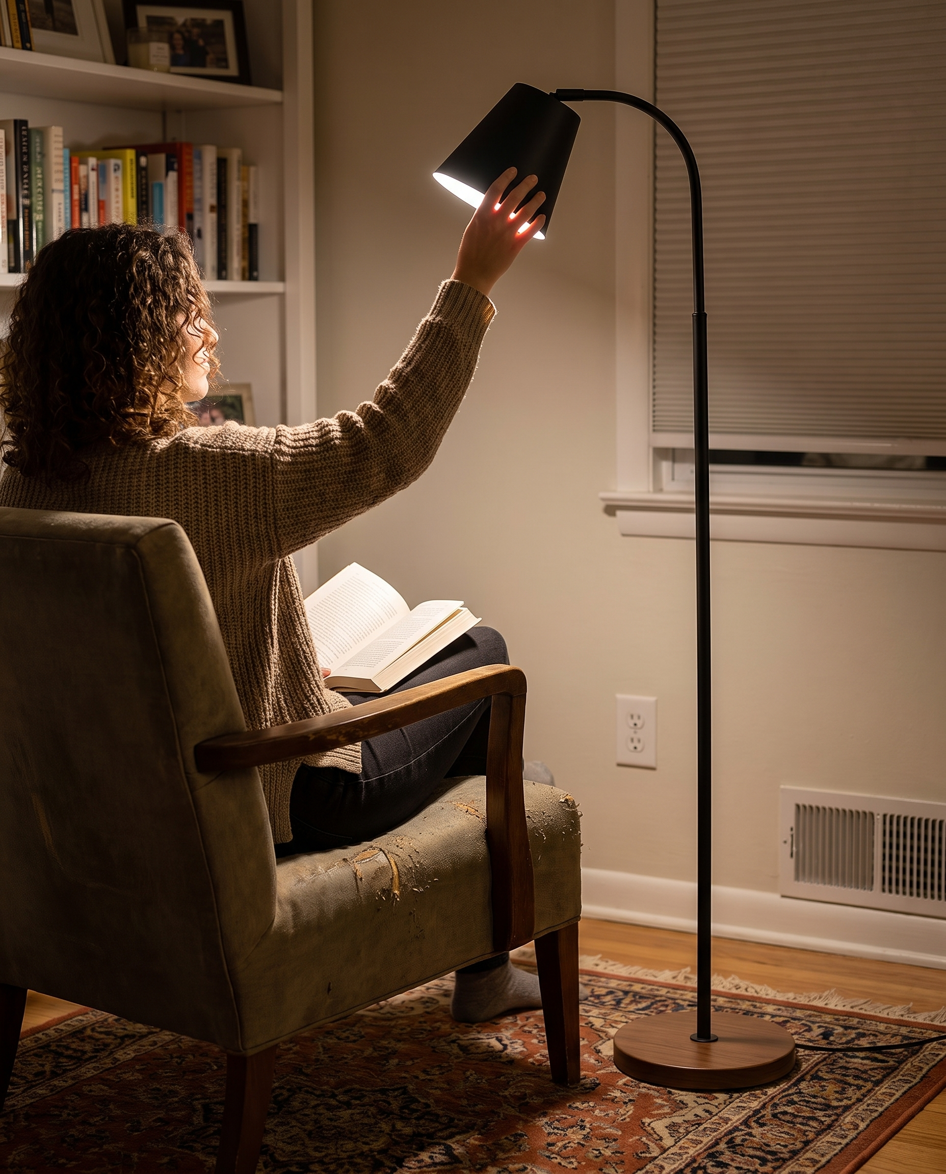 Adjustable Reading Floor Lamp with Metal Arm and Round Wood Base in use