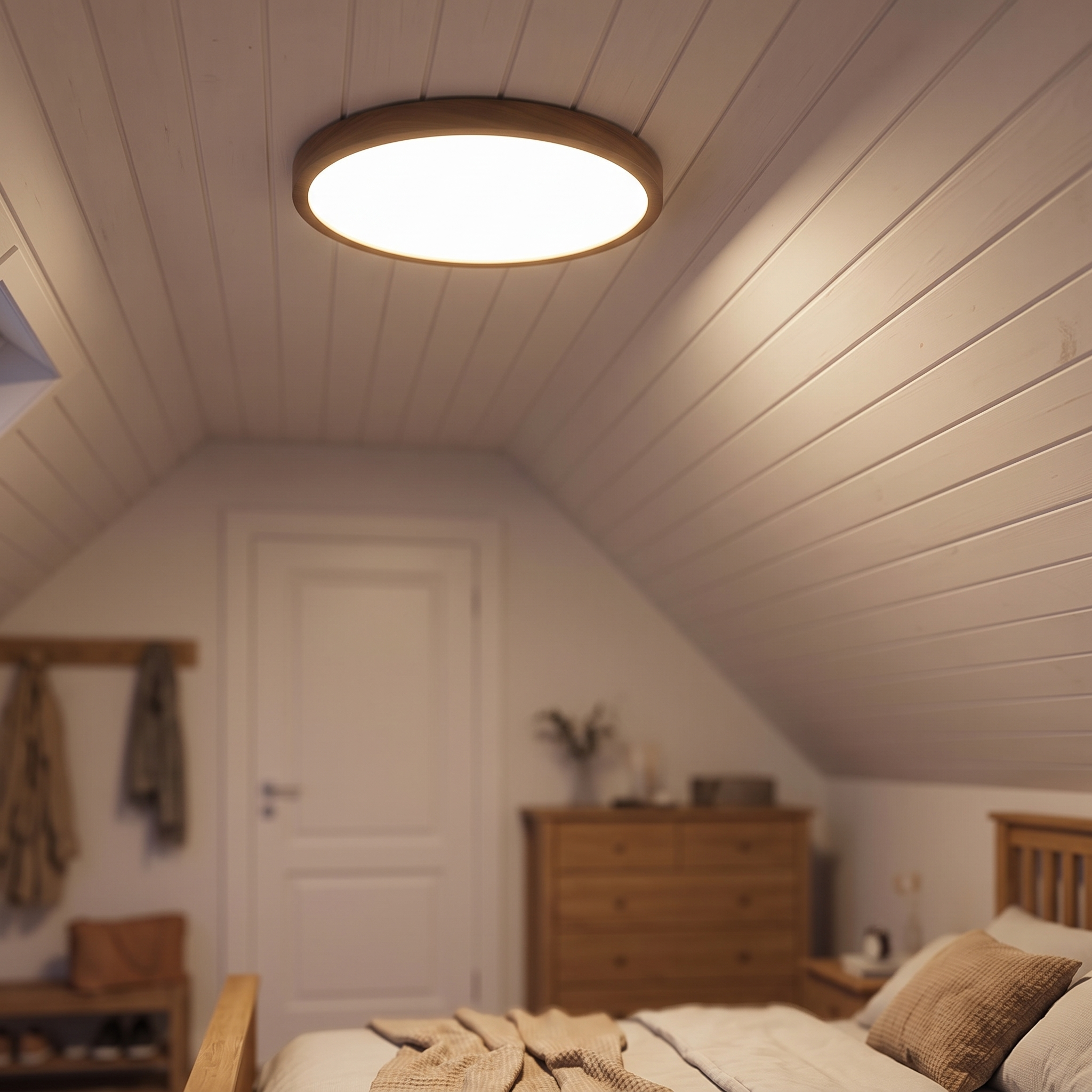 Ultra-flat round 30 cm ceiling light against a low sloping ceiling