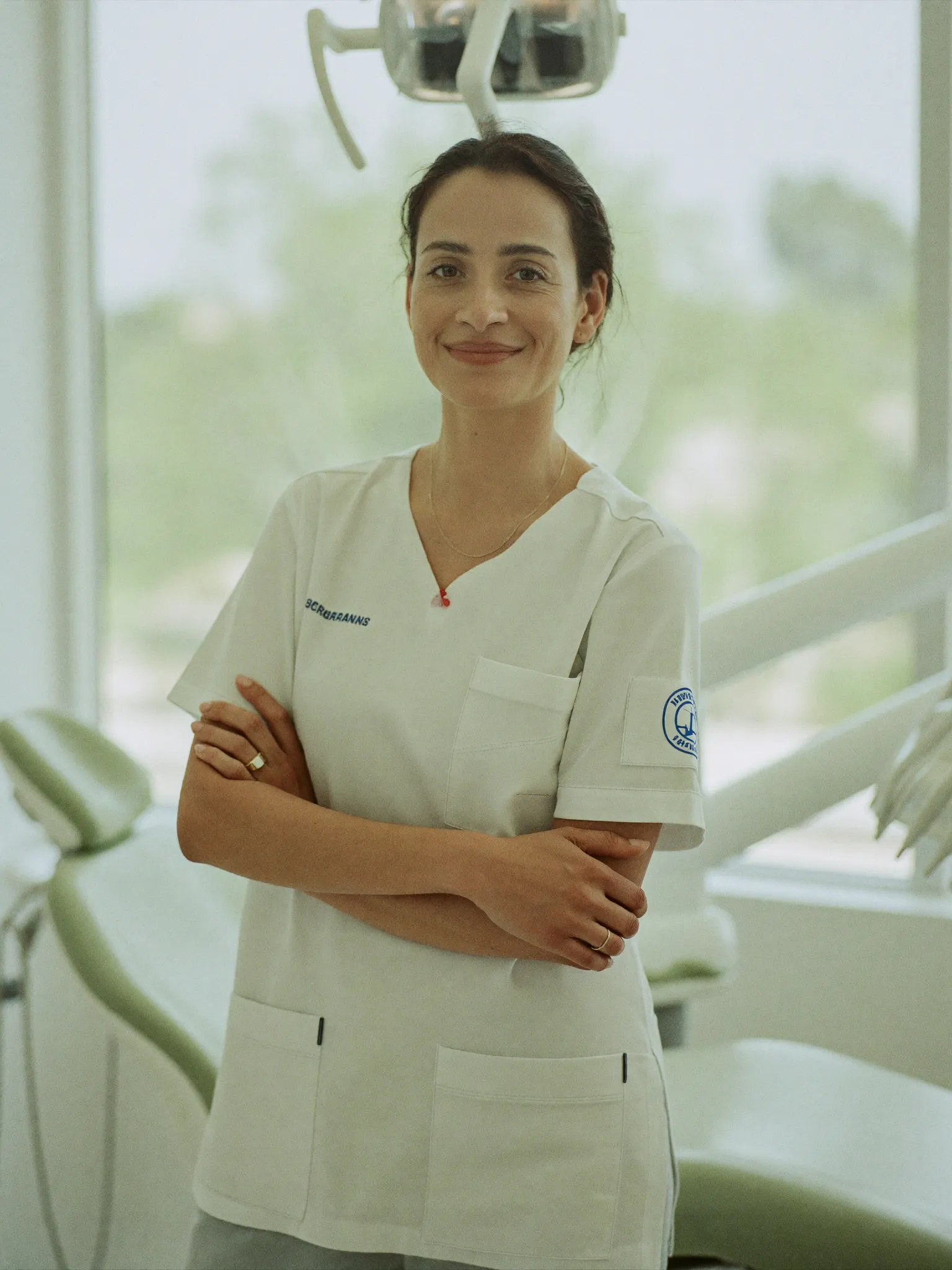 Dentist standing in a bright modern dental practice