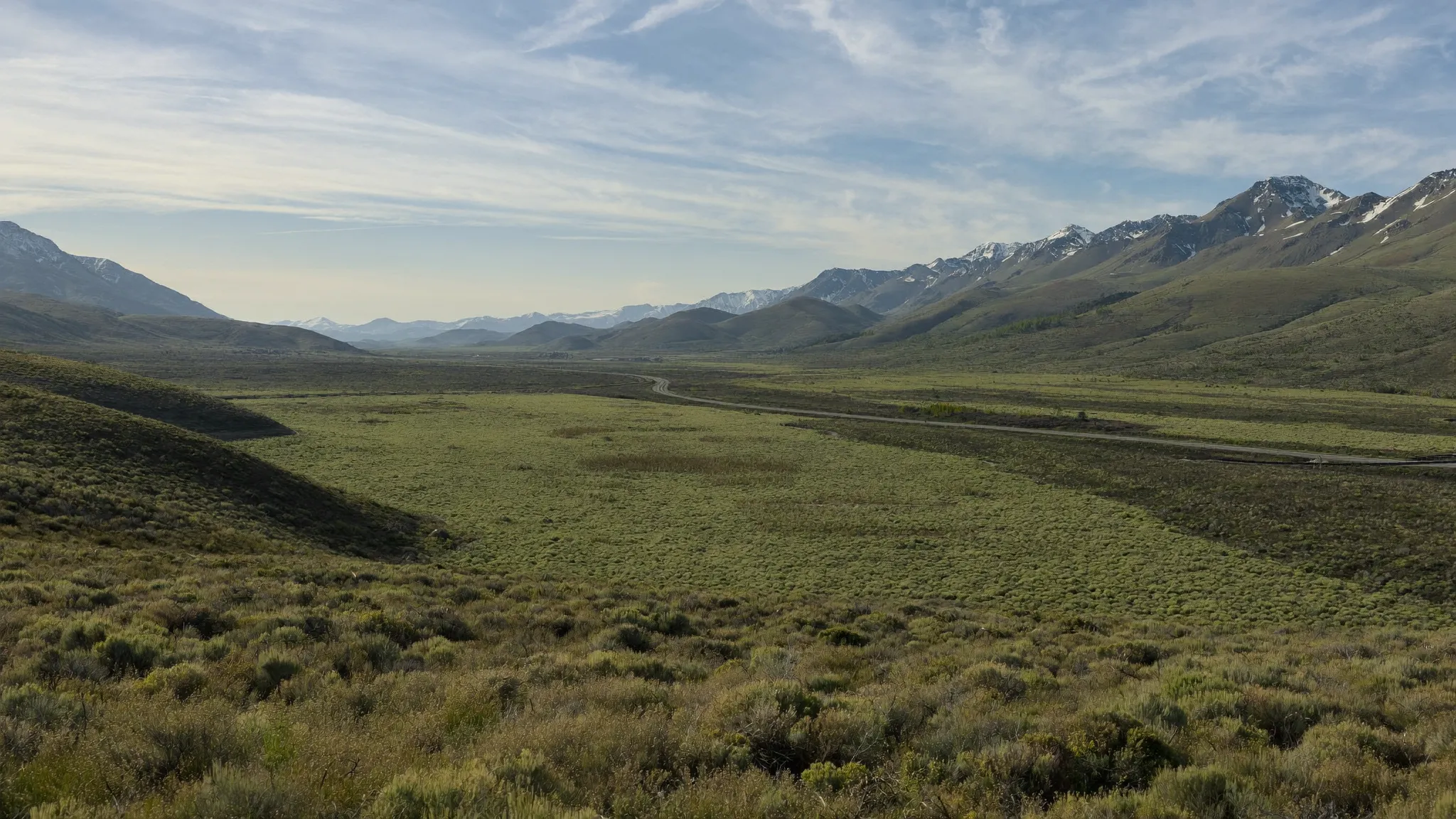 A vast sagebrush basin stretching to distant mountains in the American West