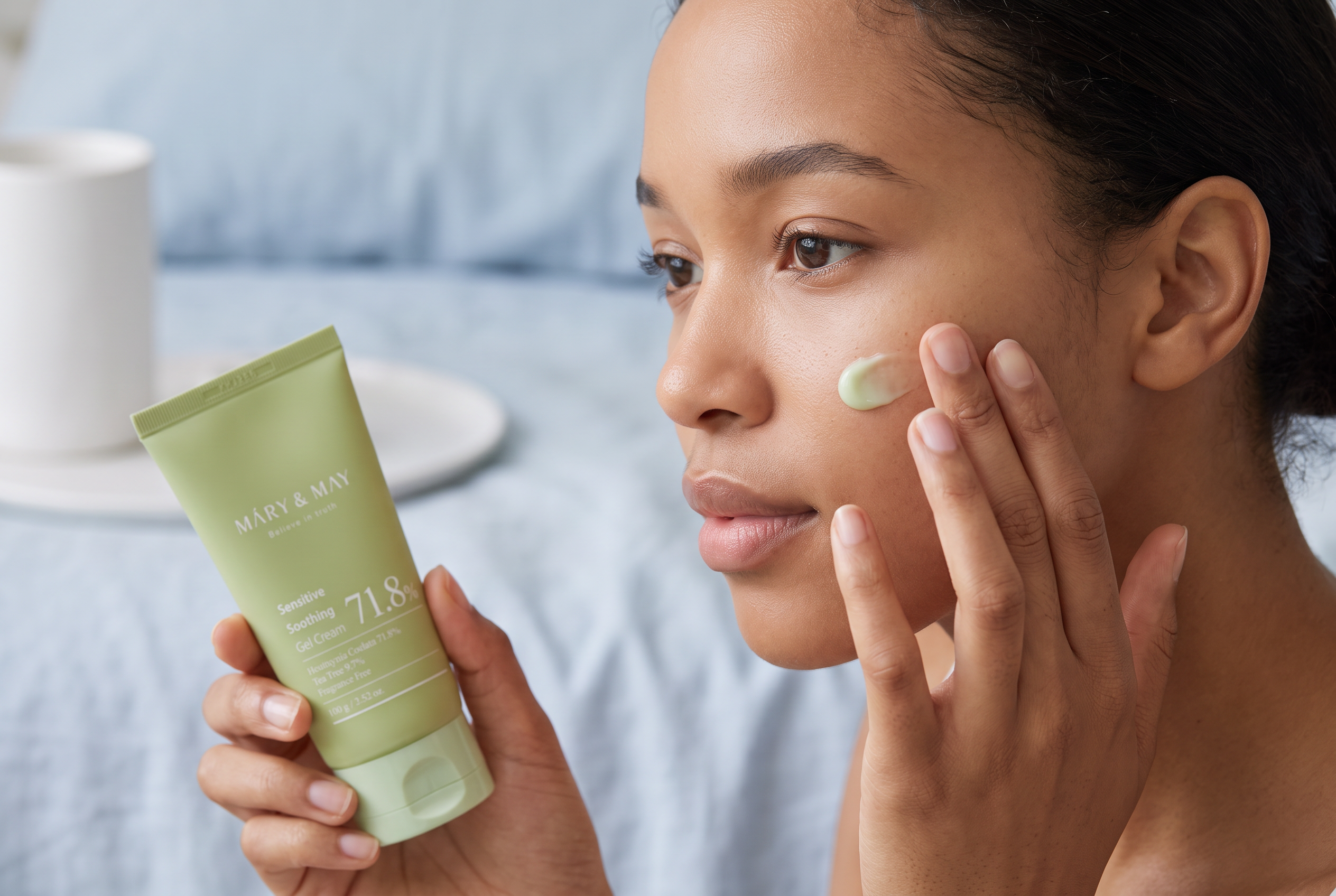Woman gently pressing Mary and May soothing gel cream onto sensitive skin