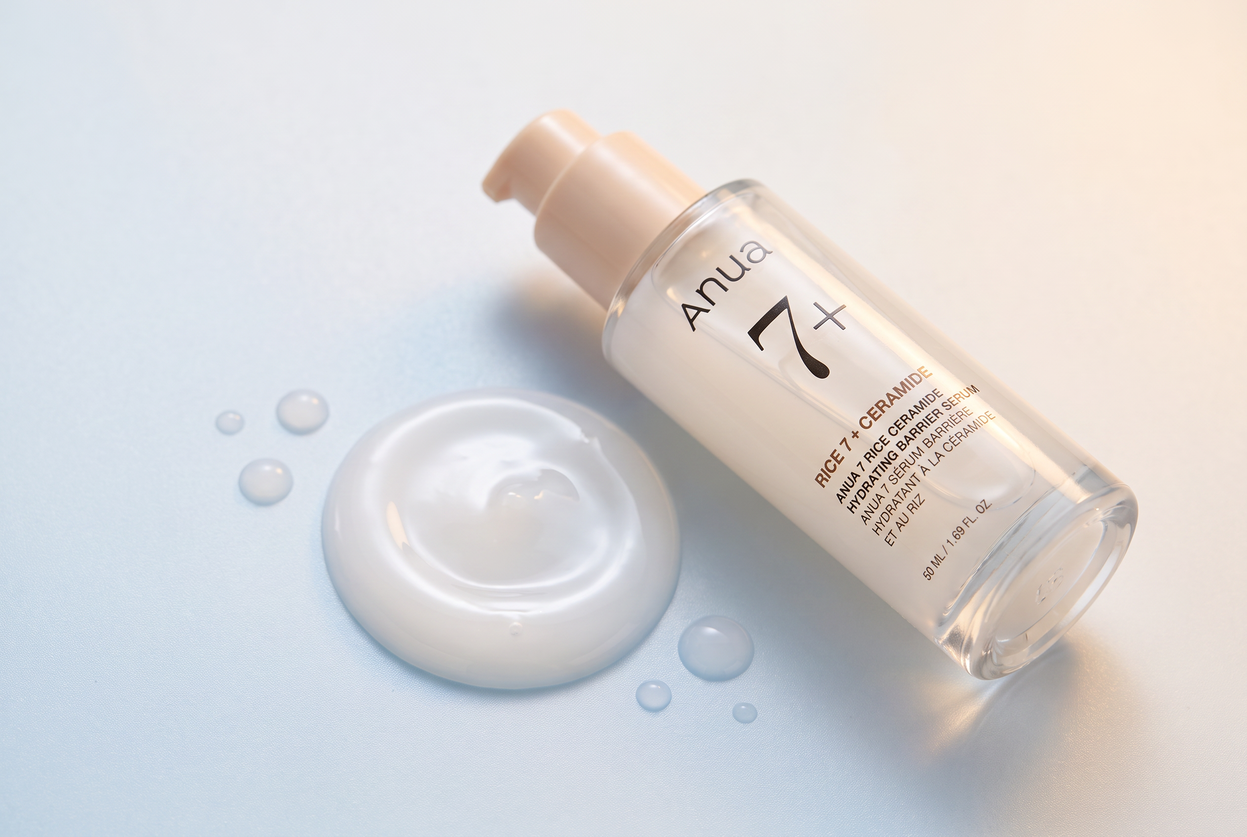 Anua 7 Rice Ceramide serum texture on a pale surface