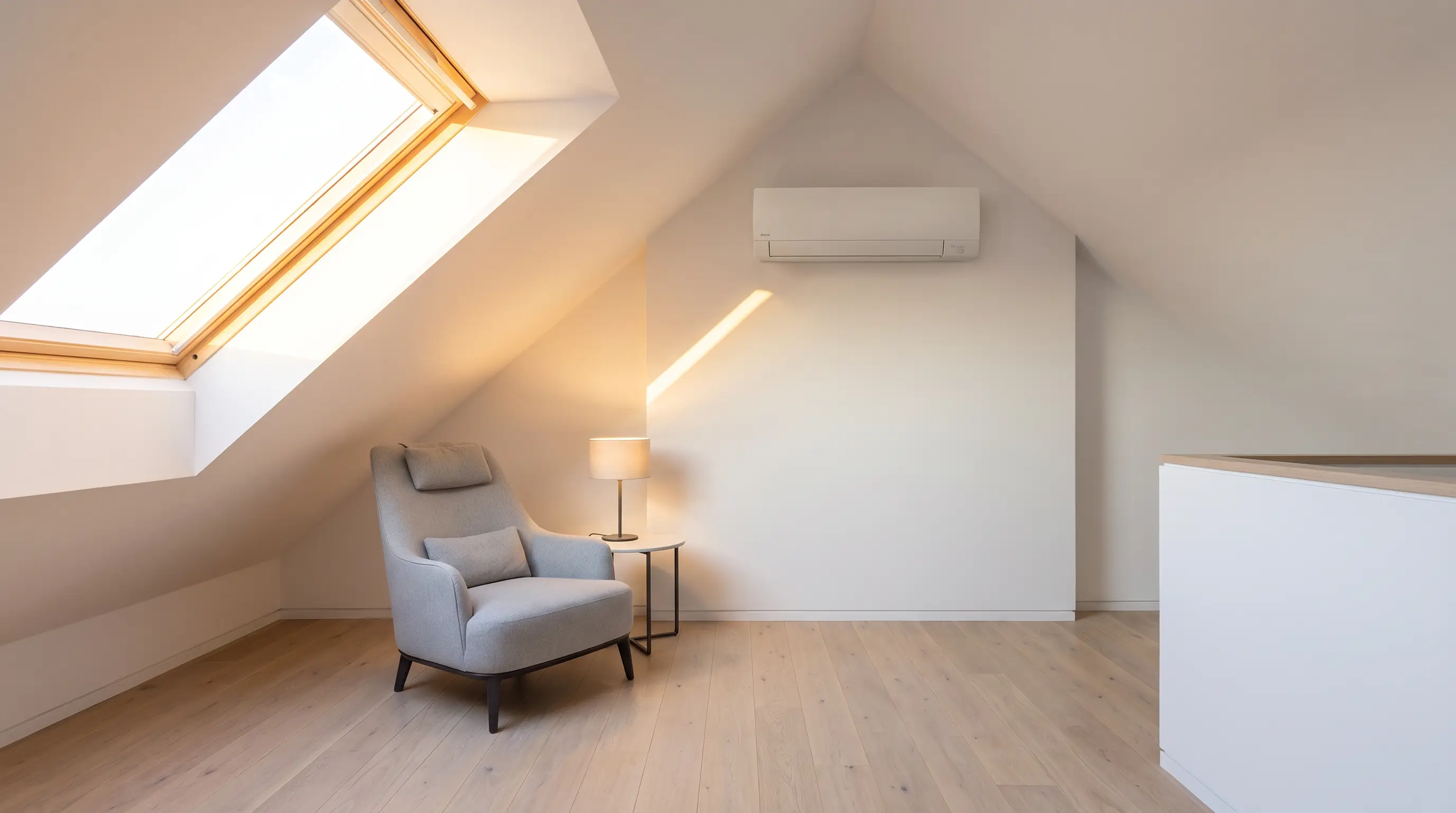 Converted loft bedroom with compact discreet air-conditioning unit