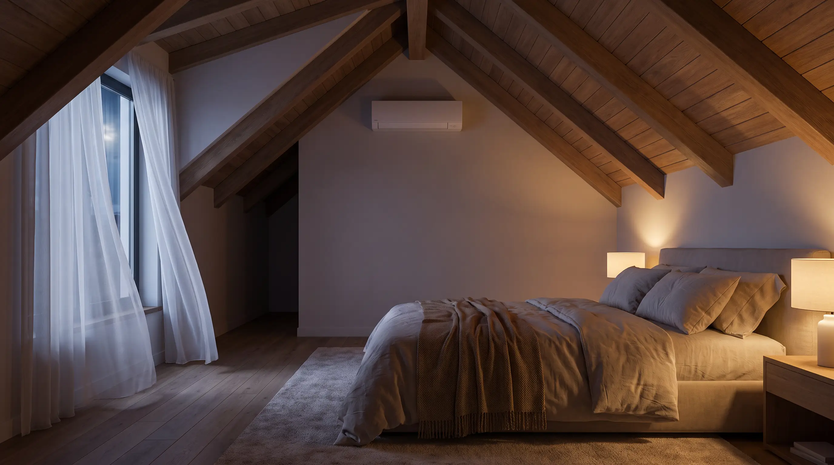 Loft bedroom at night with a compact unit on the gable wall