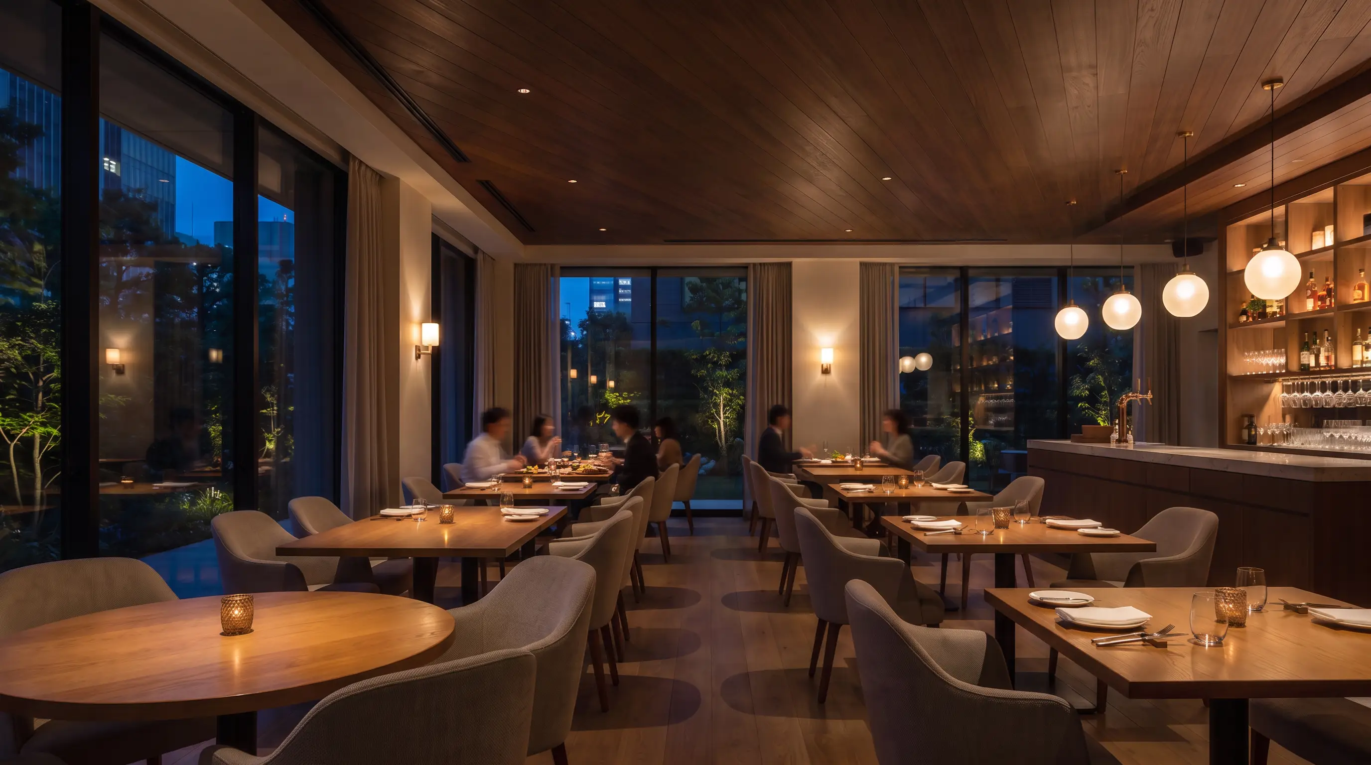 Elegant restaurant with a cassette integrated into a dark timber ceiling