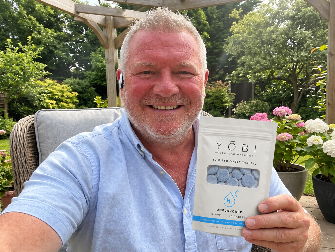 Robert holding his YŌBI molecular hydrogen pouch on his back porch
