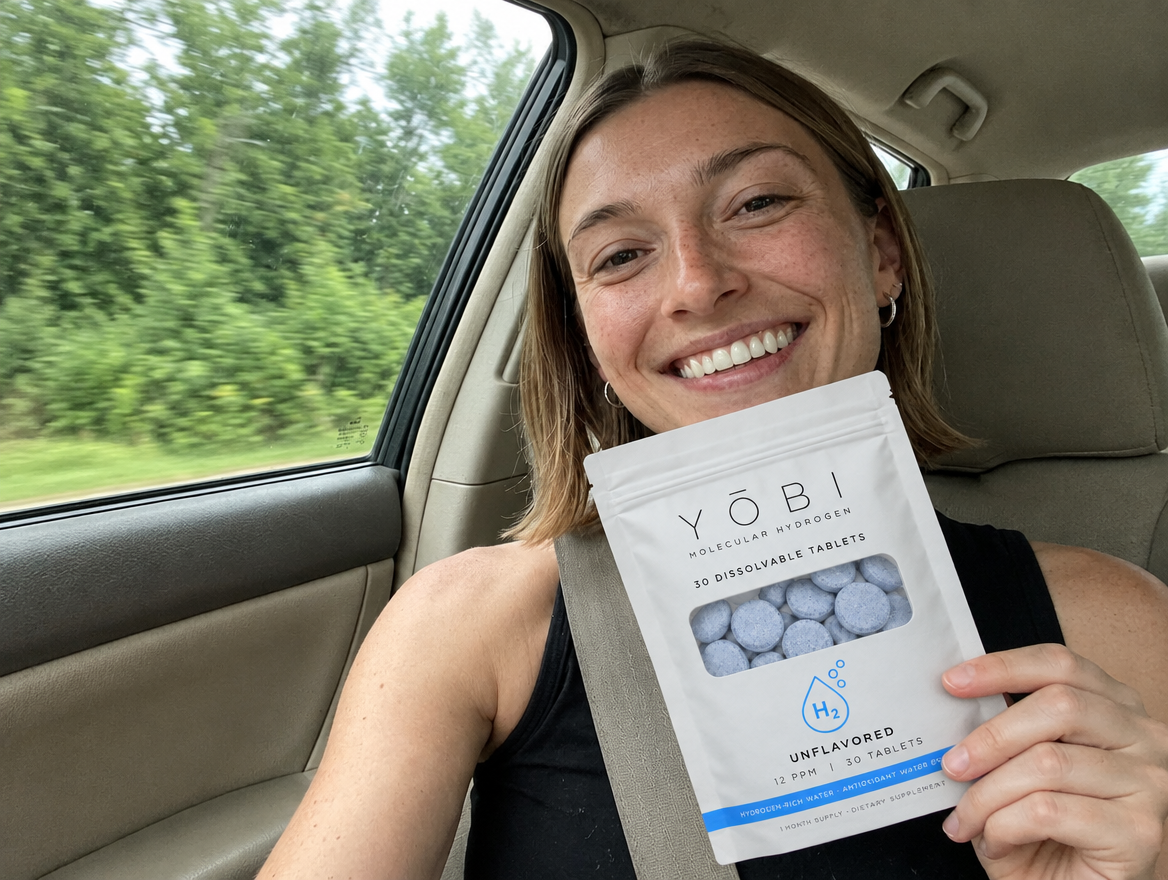 Diana holding her YŌBI pouch in the car