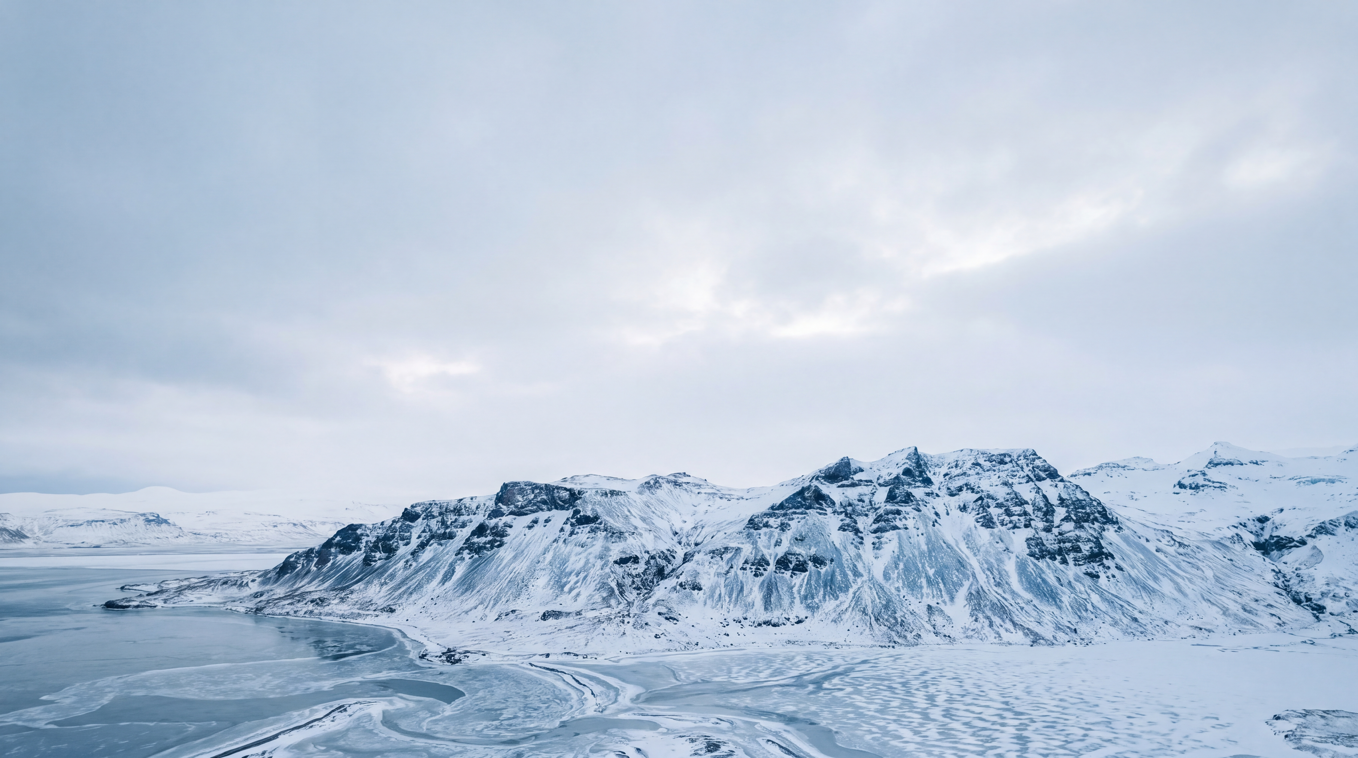 Snow draped Icelandic fjord