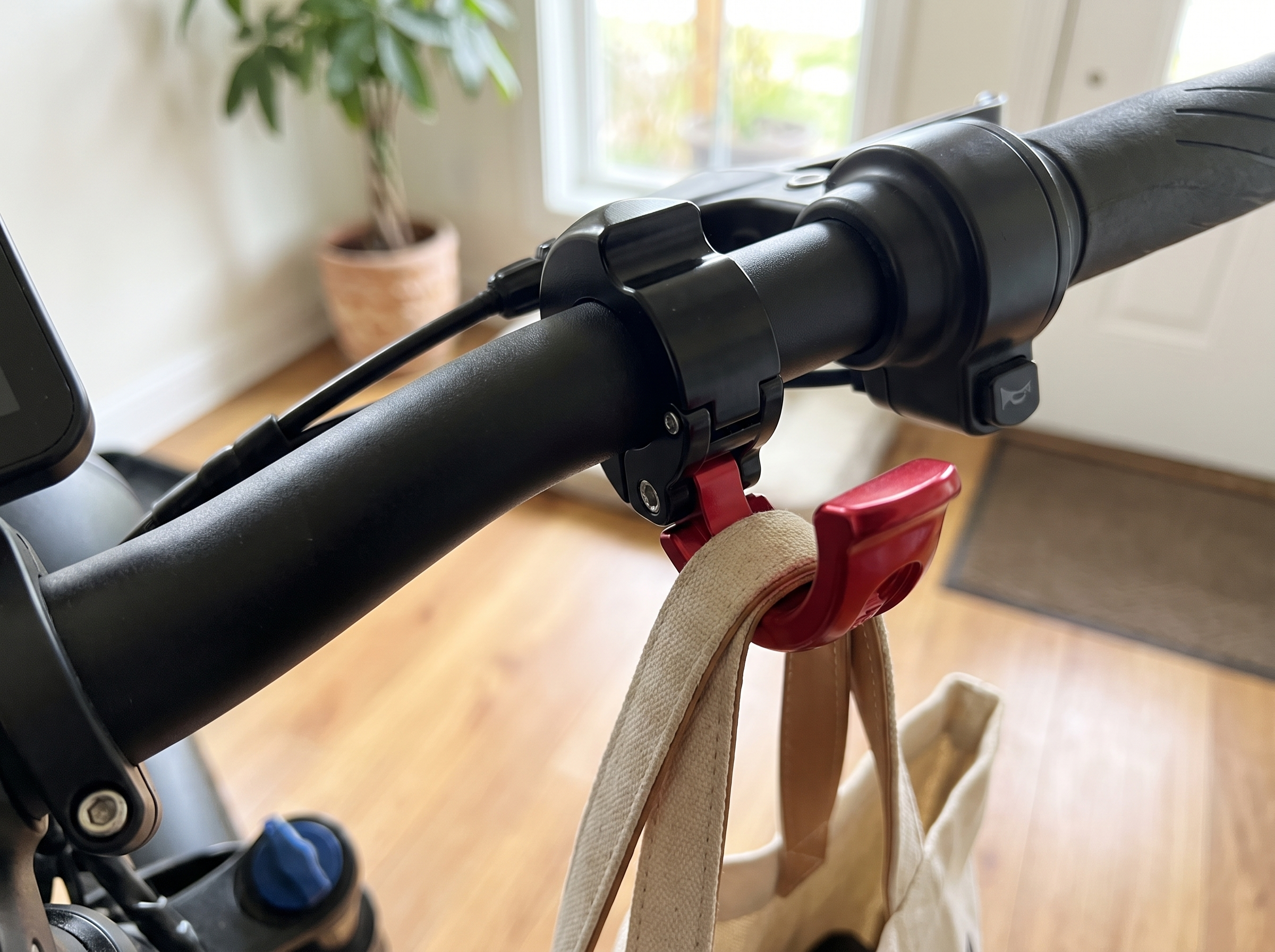 Handlebar Bag Hook for Bike, Scooter, or E-Bike in a realistic home setting