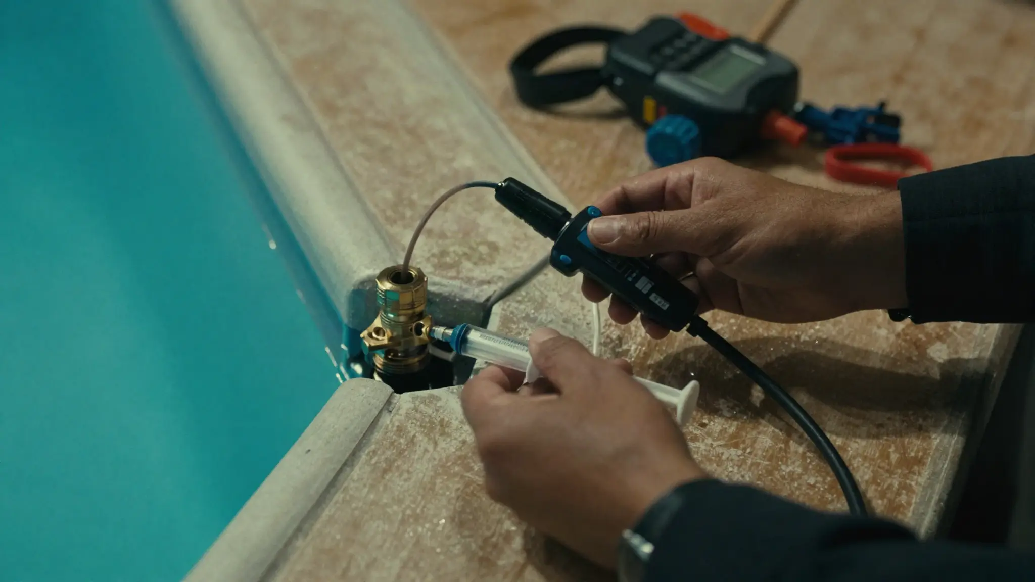 professional pool leak detection equipment testing a swimming pool