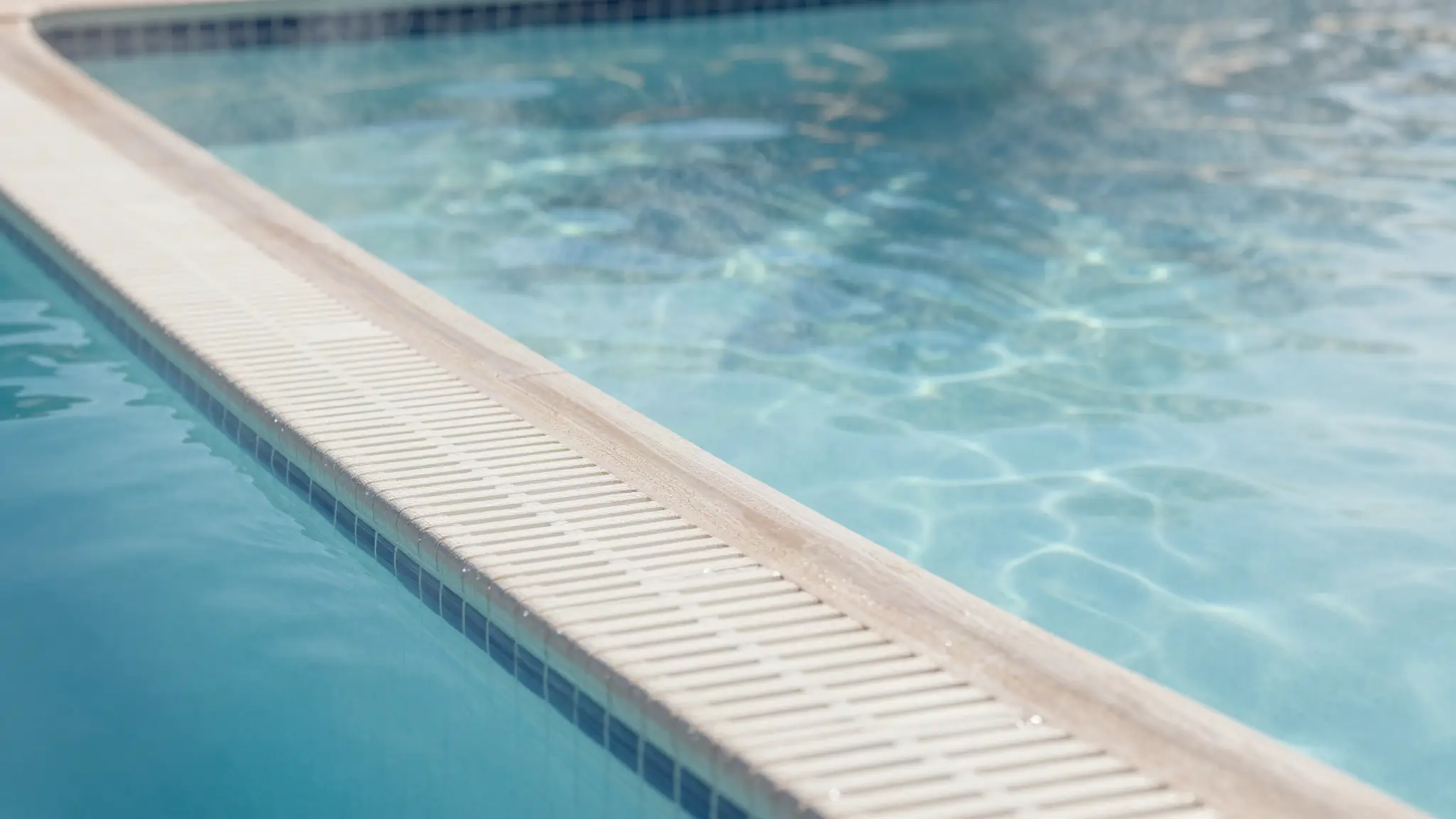 a swimming pool waterline in the Arizona sun showing normal daily water loss from evaporation