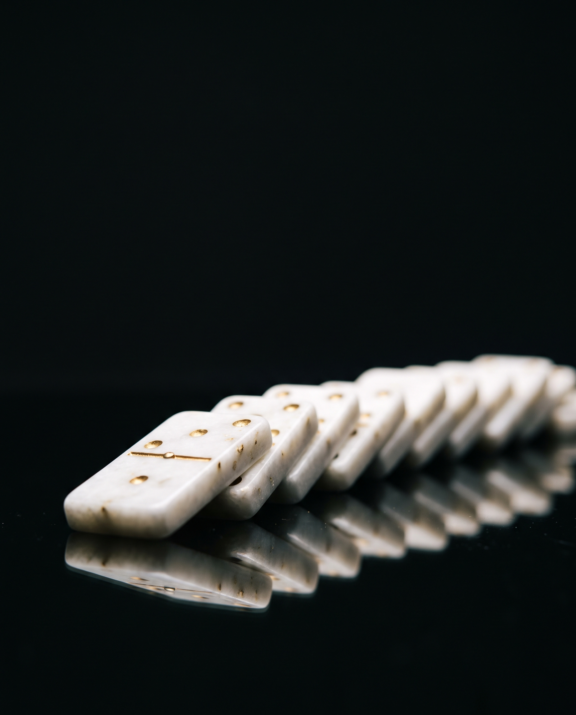Dominoes falling in sequence