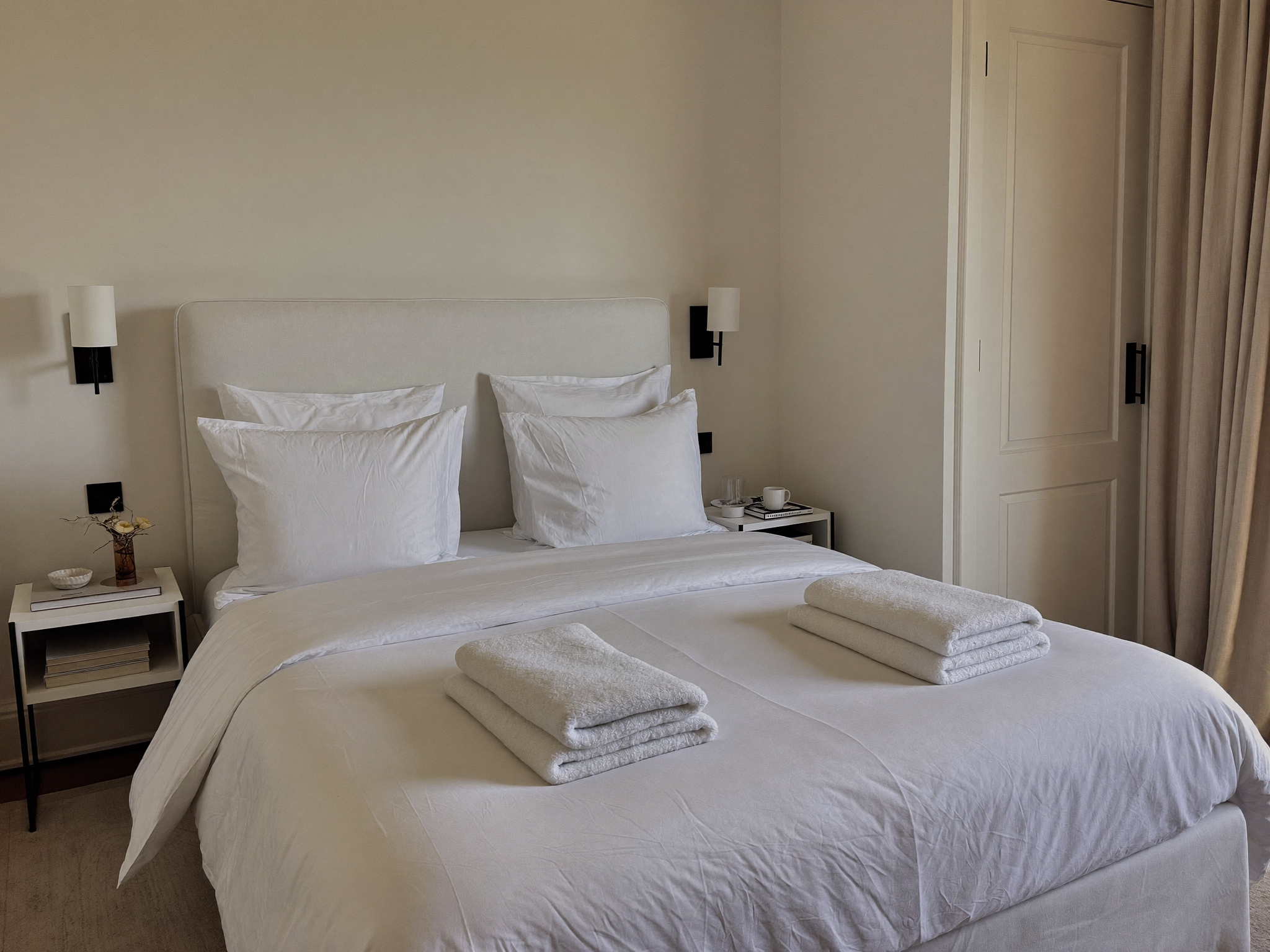 Crisply made bed in a fresh clean bedroom
