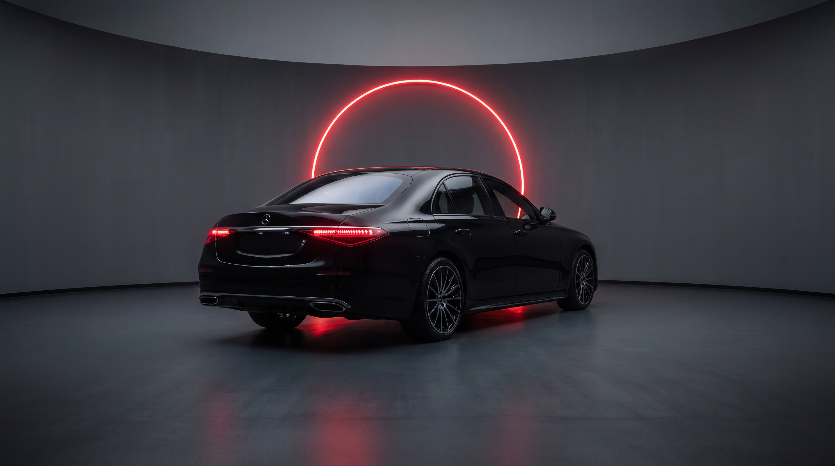 Rear three-quarter view of black sedan