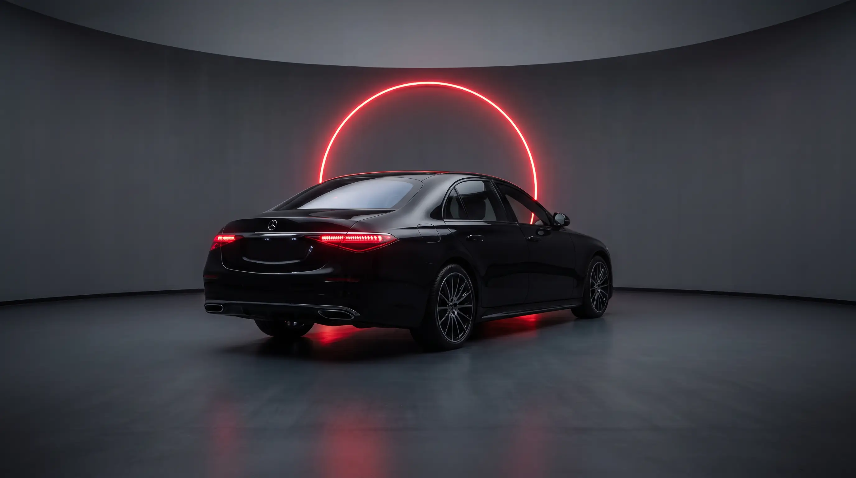 Rear three-quarter view of black sedan