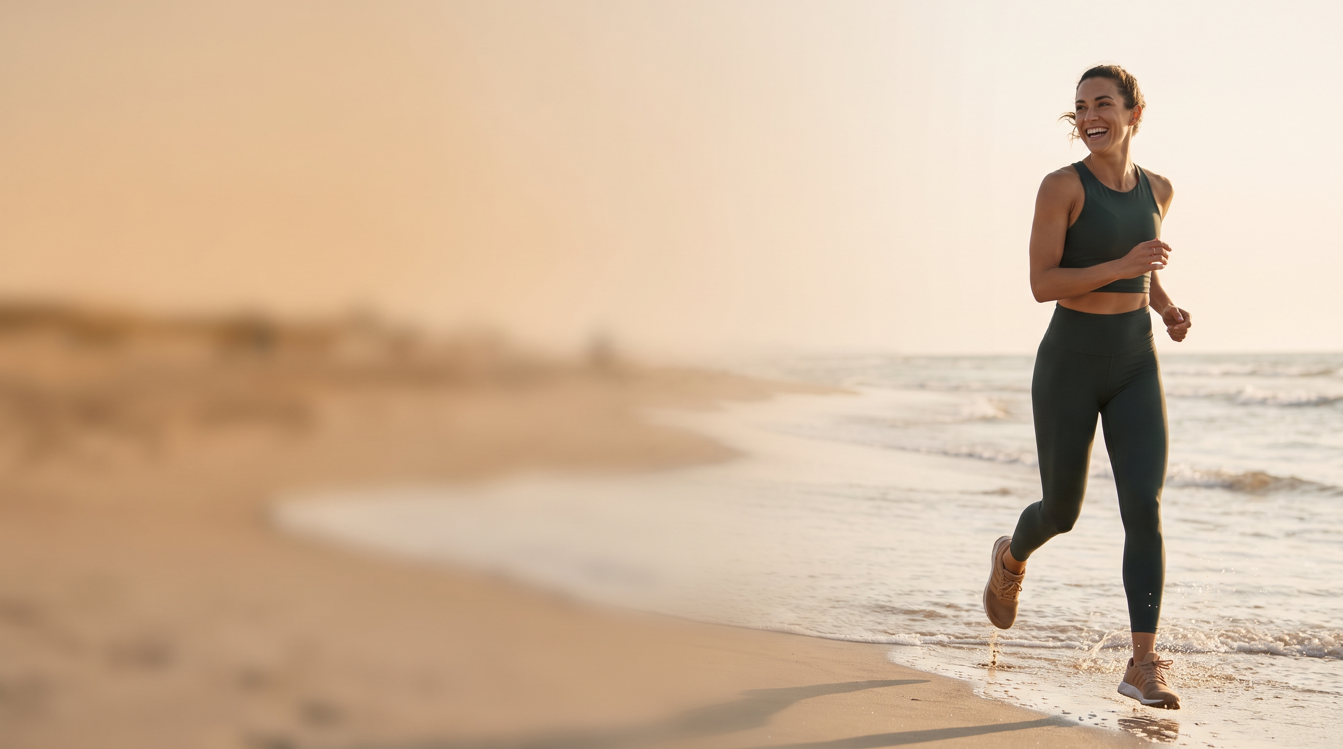 A runner on the beach at golden hour