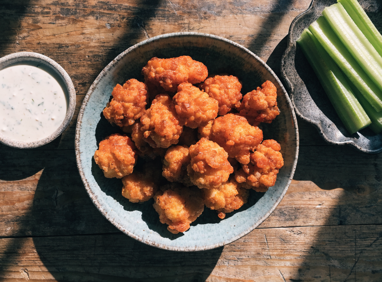 Buffalo cauliflower bites with celery and ranch
